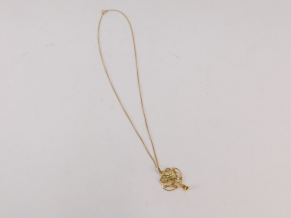 An Art Nouveau pendant and chain, the scroll design pendant set with seed pearl and peridot, 4cm hig - Image 3 of 3