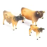 Three Beswick animal ornaments, comprising a Ch Dunsley Coy Boy Jersey bull, in matt finish, a Ch Ne