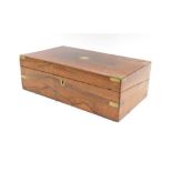 A 19thC rosewood writing box, the rectangular top with brass corners and brass shield, with a fitted