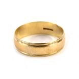 A 9ct gold wedding band, with two row outer banded border, ring size S, 2.5g all in.