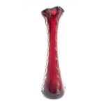 A red art glass vase, with applied five ribbed sides and flared top, 54cm high.