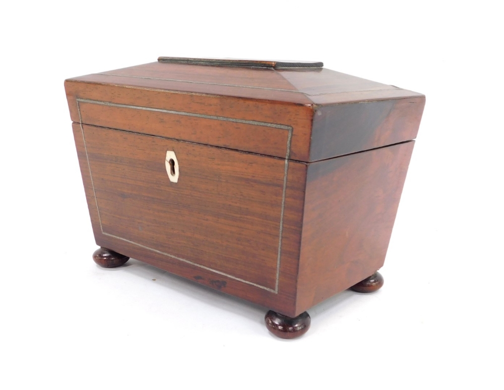 A 19thC rosewood tea caddy, the canted top with silvered line detailing and bone escutcheon, with a