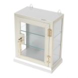 A steel glass display cabinet, with folded cornice top and single shelf, with key, 46cm high, 38cm w