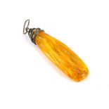 An amber pendant, the polished light orange amber, with outer reeding and a white metal spiral penda