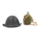 Military wares, comprising a military tin hat, painted black, 30cm wide, and a carrying water vessel