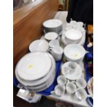 A Hungarian porcelain part dinner service, of plain white design with silver and black gilt banding,