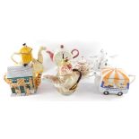 A group of character teapots, comprising a Tony Wood camel teapot., Angler teapot., Arthur Wood Crea