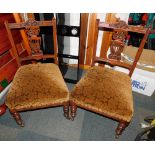 A pair of Victorian nursing chairs, with carved splats.