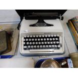 A cased typewriter.