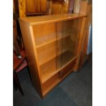 A Leby Furniture oak fall front bookcase, with glazed upper section and two lower doors.