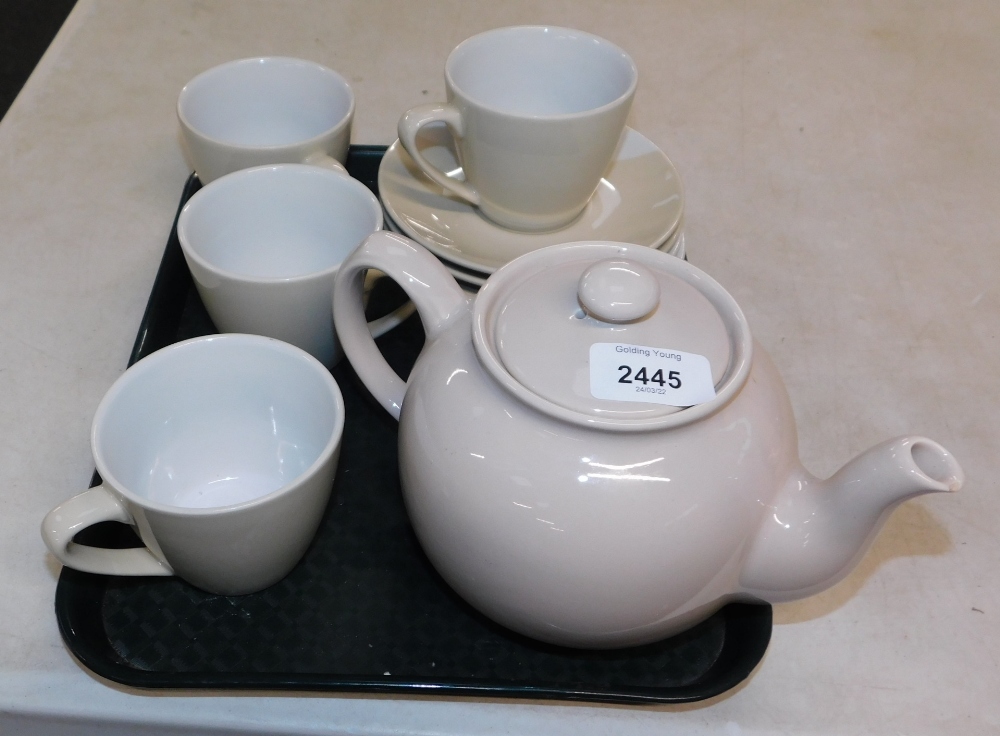 Four M & S Eclipse cups and saucers together with a Sadler teapot.