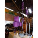 A pair of chrome and purple sphere standard lamps, and a matching pair of table lamps. (4)