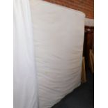 A double divan bed and mattress.