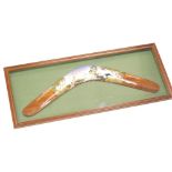 20thC Aboriginal School. Boomerang painted with a kangaroo in silhouette, framed, 22cm x 54cm.