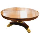 A William IV rosewood tilt top breakfast table, the plain circular top on a tapering stem and platfo