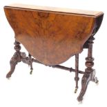 A Victorian walnut Sutherland table, with shaped drop leaf top, on turned supports terminating in ca