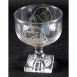 An early 19thC Masonic glass rummer, engraved with symbols, panels and flowers, on a lemon squeezer