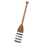 A vintage oar, with T shaped handle and shaped blade, in blue and white stripes, probably mid 20thC,