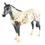 A Beswick Appaloosa horse standing, printed marks beneath, 19cm high.
