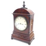 A Victorian mahogany bracket clock, the arched top with a turned and gadrooned finial above a painte