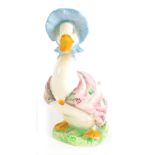 A Beswick Beatrix Potter figure Jemima Puddle-Duck, gold oval back stamp, 11cm high.