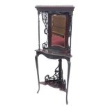 An Edwardian mahogany corner display stand, the top with a gilt brass gallery above a cartouche shap