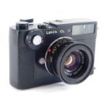 A Leica CL Leitz Wetzlar camera, with 1:2/40 Leitz Wetzlar lens 2554209, with lens cap and outer cas