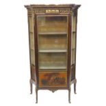 A late 19thC/early 20thC French vitrine, with a shaped marble top above a frieze inlaid with gilt me