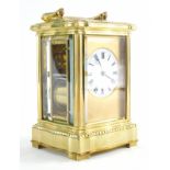 A late 19thC French brass repeating carriage clock, with swing handle and five part glazed case, 5cm