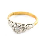 An 18ct gold diamond solitaire ring, with illusion set round brilliant cut diamond, totalling approx