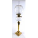 A late 19th/early 20thC oil lamp, with clear and opaque etched shade and a cut glass reservoir on a