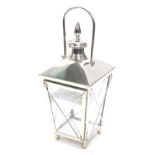 A chrome plated lantern, of tapering form with bun feet, unused, 73cm high.