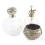 An Edward VII cut glass and silver topped perfume bottle, the bulbous body decorated with a repeat h