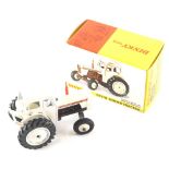 A Dinky Toys diecast David Brown tractor, in white and brown, number 305, 7cm high. (boxed)