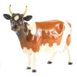 A Beswick Ayrshire cow, Ickham Bessie, printed marks beneath, 12cm high.