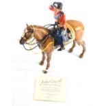 A John Beswick Trooping The Colour figure, Queen Elizabeth II, on horse back, marks beneath, 25cm hi