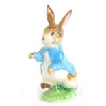 A Beswick Beatrix Potter figure Peter Rabbit, gold oval backstamp, 11cm high.