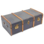 A black canvas and wooden banded trunk, with leather carrying handles, 91cm wide.