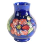 A Moorcroft Clematis pattern vase, bulbous body, on circular foot, impressed and signature marks ben