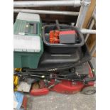 A Mountfield 480RE petrol lawn mower and various tools.