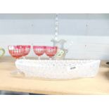 A Victorian Sowerby opalescent glass Grace Darling boat, set of four ruby flash wine glasses, and a