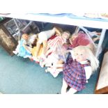 A large quantity of plastic and other dolls.