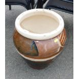 A brown glazed plant pot.