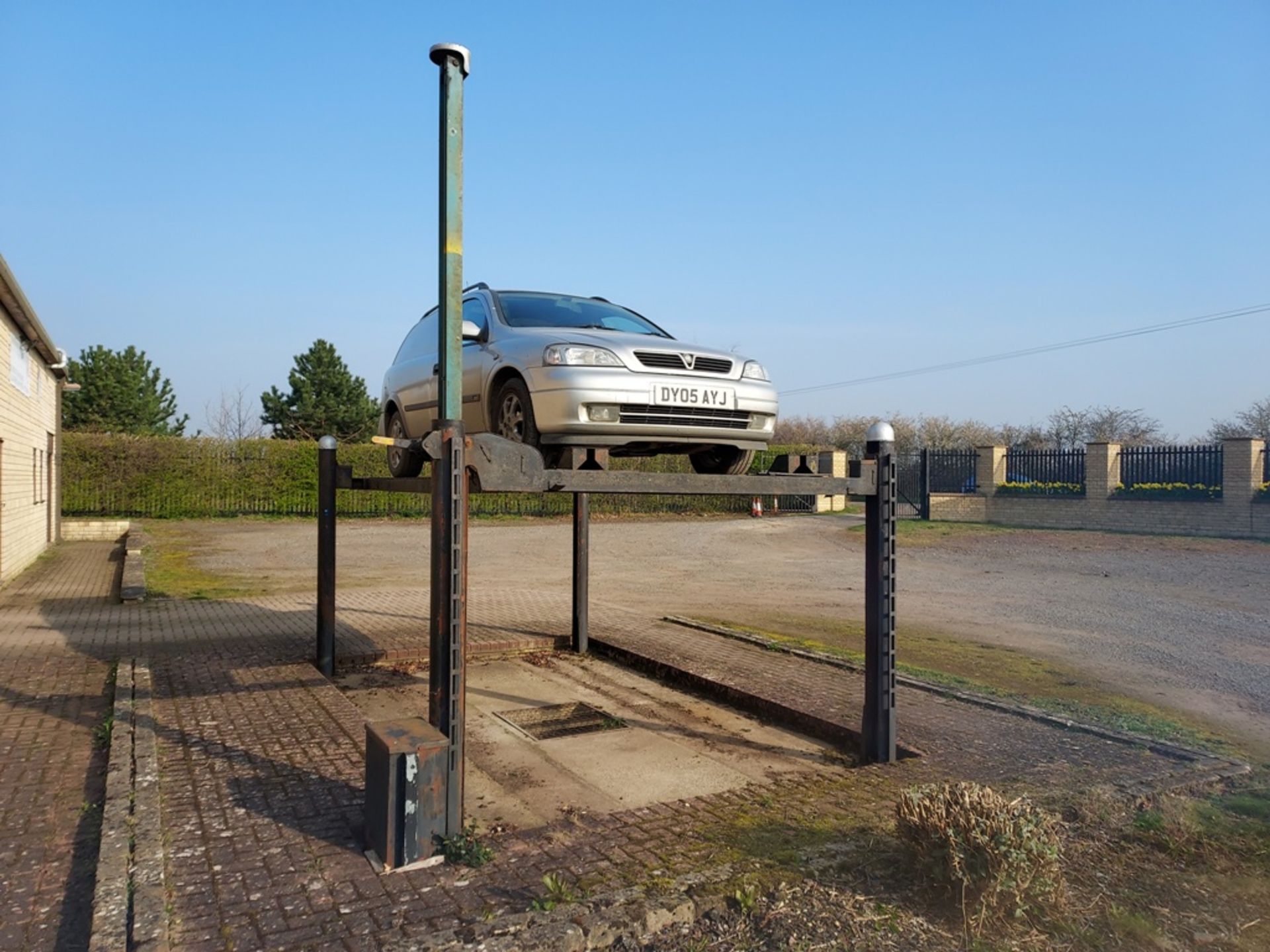 An outdoor 3 ton Bradbury 4 post vehicle lift, 3 phase.