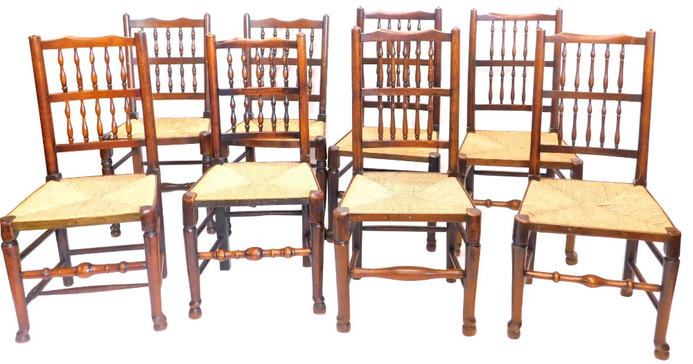 A harlequin set of eight Lancashire type spindle back dining chairs, comprising five 19thC chairs an