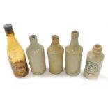 A 19thC stoneware porter bottle, impressed Harrison Lincoln, 22cm high, various other porter bottles