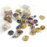 A group of vintage buttons, comprising enamel, brass and material buttons, in the Art Nouveau and la