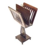 An unusual late 19thC mahogany folio stand or Canterbury, with a brass handle hinged slatted sides o