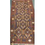 A Middle Eastern carpet, the outer field with a geometric floral pattern, the inner set with diamond