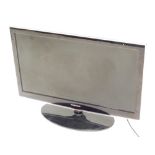 A Samsung 30'' television, with wire.